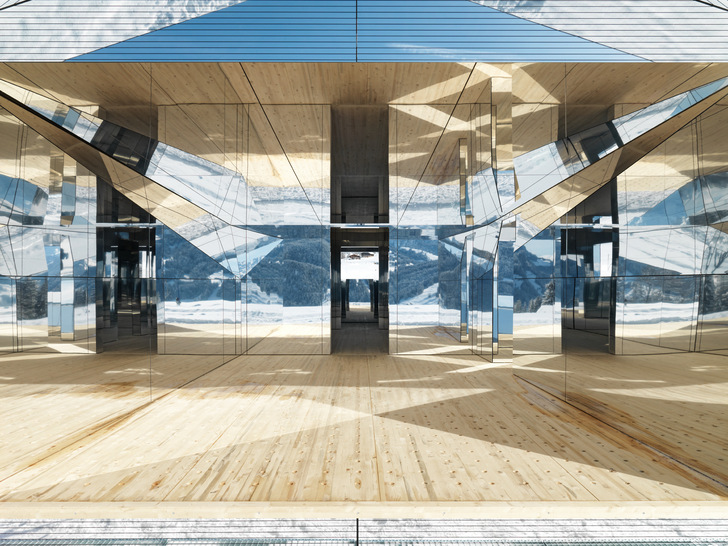 The mirror façade reflects weather, light and landscape, allowing a moving image to pass by in real time. Everything is in flux. - © Stefan Altenburger
 The mirror façade reflects weather, light and landscape, allowing a moving image to pass by in real time. Everything is in flux.