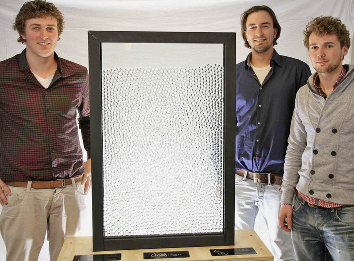 Proud students presenting their functional prototype of the IOR shading system. When no shading is required, the transparent spheres are immersed in a liquid with the exact same refractive index and so become invisible. - © Bucky Lab / TU Delft
 Proud students presenting their functional prototype of the IOR shading system. When no shading is required, the transparent spheres are immersed in a liquid with the exact same refractive index and so become invisible.